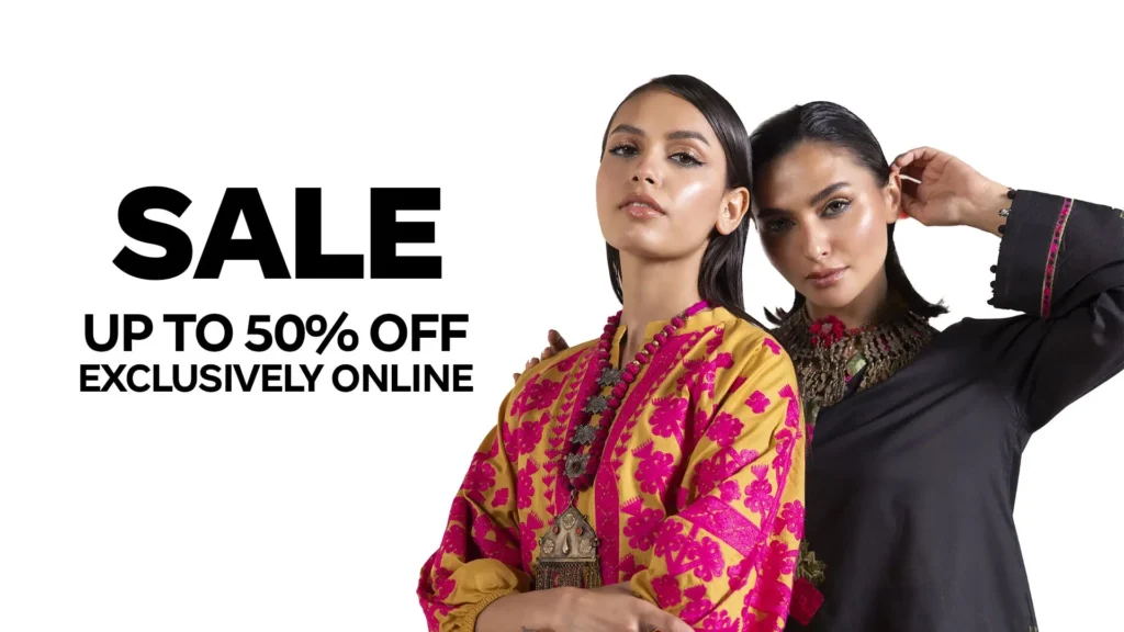 Close-up of an artisan’s hands sewing detailed embroidery onto a brightly printed Khaadi cotton suit, illustrating expert craftsmanship and eye-catching design.