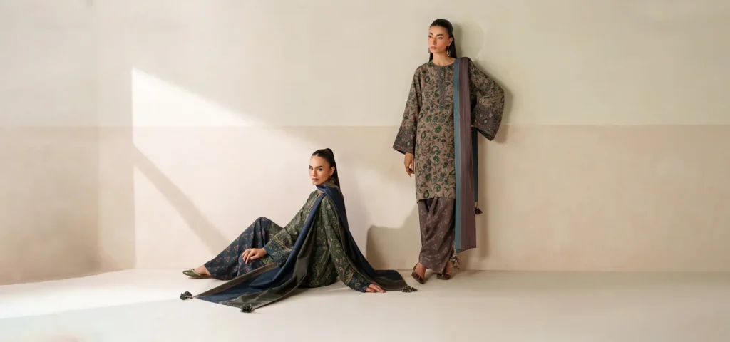 Mannequins dressed in Baroque festive and formal wear are arranged in a chic retail store, highlighting the brand’s luxurious fabrics and embroidery.