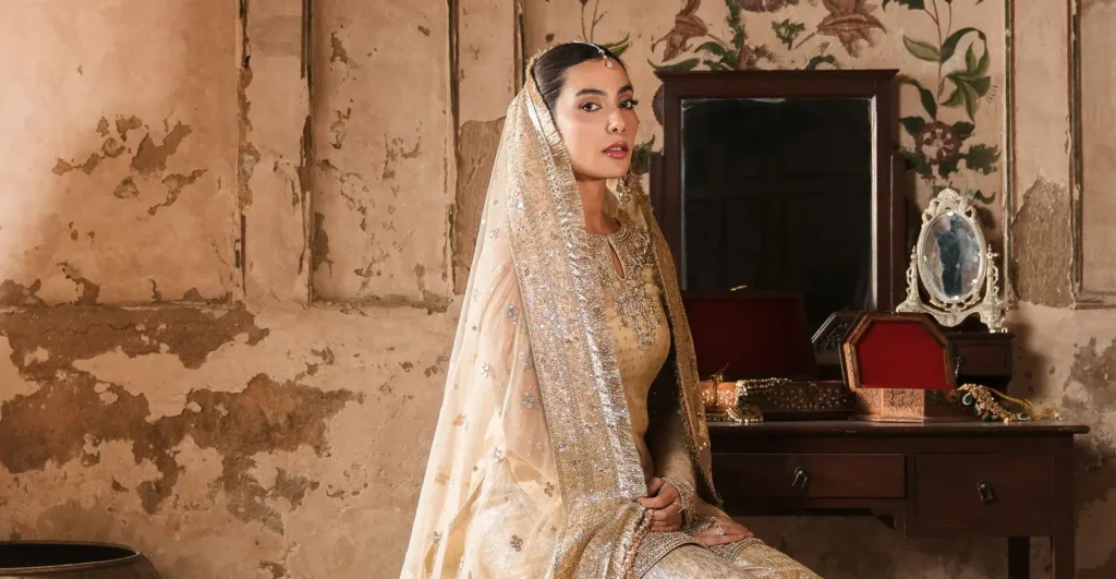 Mannequins in intricately embellished Faiza Saqlain bridal outfits highlight the designer’s craftsmanship and luxurious fabrics.