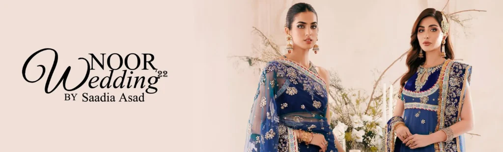 An elegant shot of a retail boutique's interior, featuring a well-lit corner dedicated to the Saadia Asad collection.