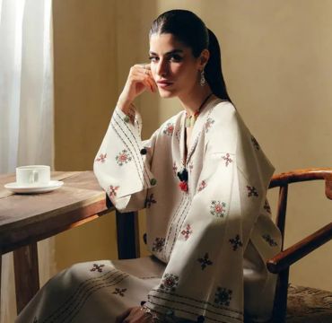 Fine embroidery and beadwork on Elan fabric, demonstrating the craftsmanship and artistry that define the brand.