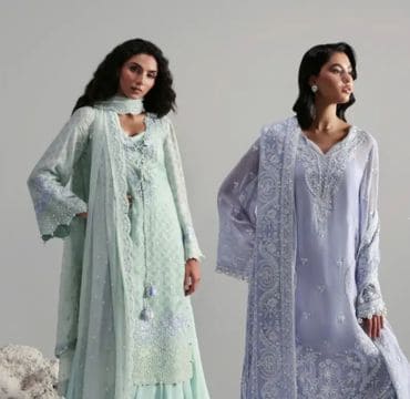 Mannequins dressed in Afrozeh’s intricately embroidered formal dresses, showcased at an upscale boutique entrance.