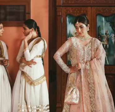 A stunning bridal outfit designed by Kanwal Malik, showcasing intricate embroidery and luxurious fabrics, representing the brand's commitment to elegance and quality.