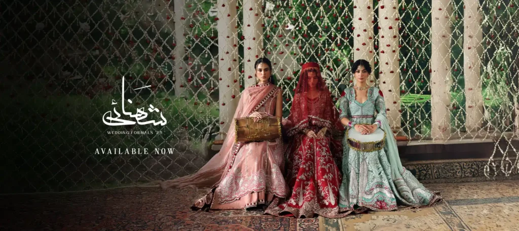 Mannequins dressed in Afrozeh’s intricately embroidered formal dresses, showcased at an upscale boutique entrance.