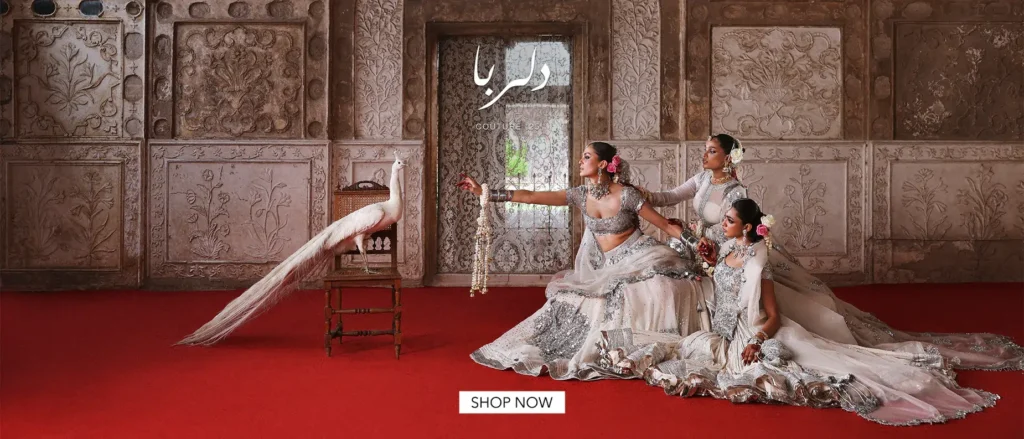 An artfully arranged flat lay of several key pieces from the latest collection, highlighting intricate embroidery and unique silhouettes.