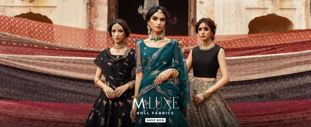 Mannequins dressed in embroidered Maria B festive outfits, highlighted at the entrance of an upscale boutique.