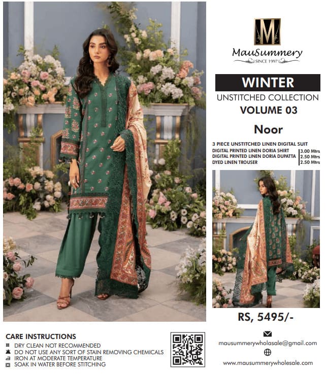 Mannequins in Mausummery lawn suits with vibrant prints at a boutique entrance.