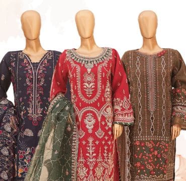 Shop assistants arranging new Bin Saeed garments on racks, preparing the store for an upcoming launch.